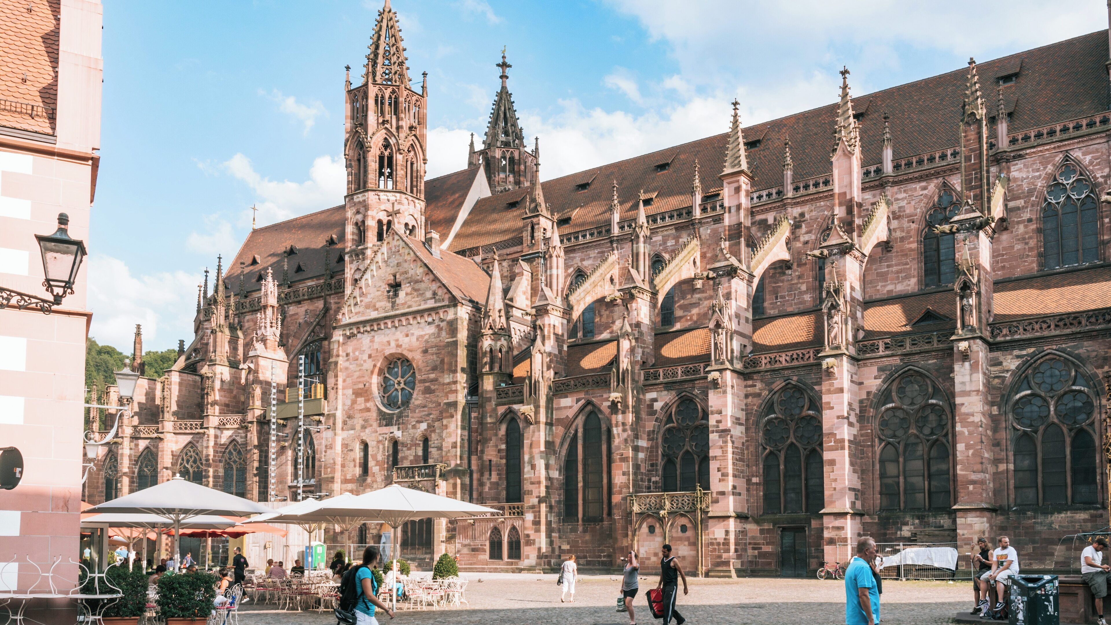 Freiburg Main Cathedral showcases stunning Gothic architecture in Freiburg im Breisgau, Baden-Württemberg, Germany on a sunny day