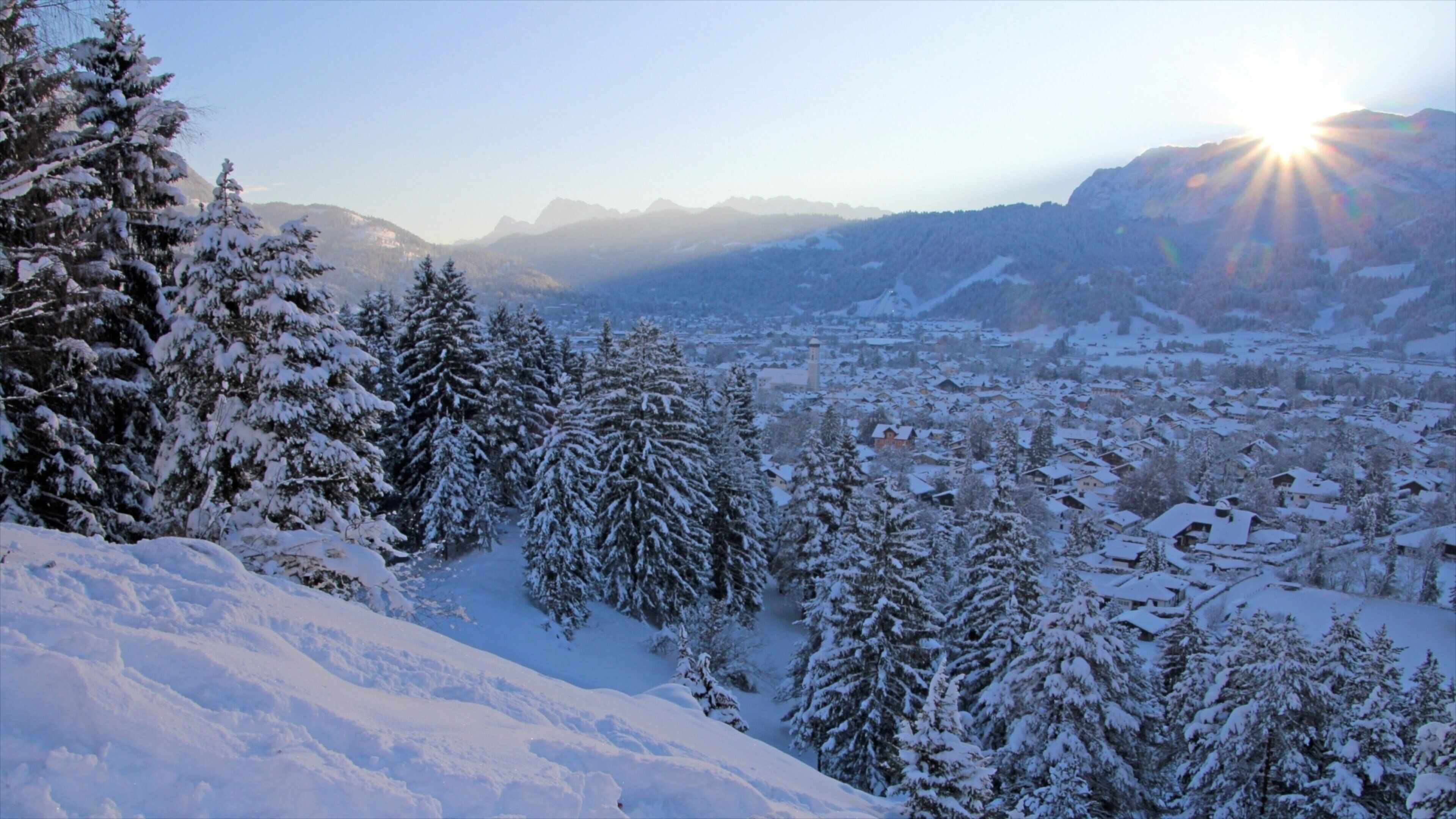 Garmisch-Partenkirchen Ski Resort featuring forests, landscape views and a small town or village