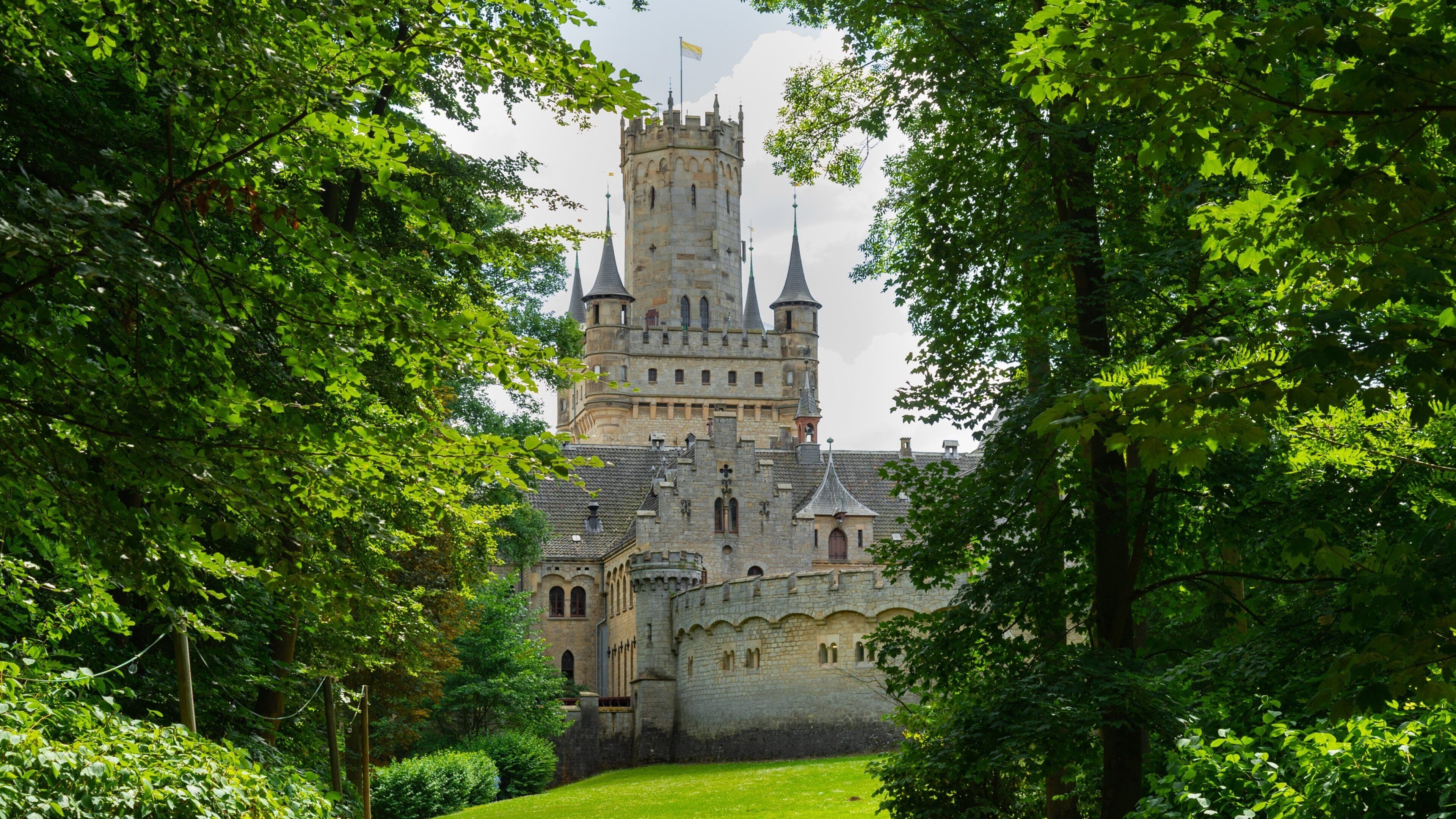 A castle surrounded by lush greenery.