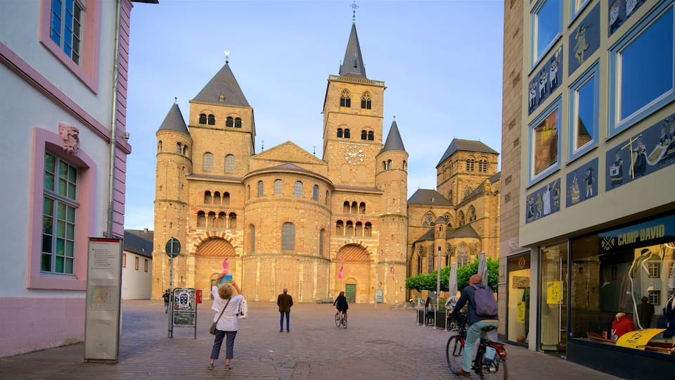 A historic church with two towers and a large clock.