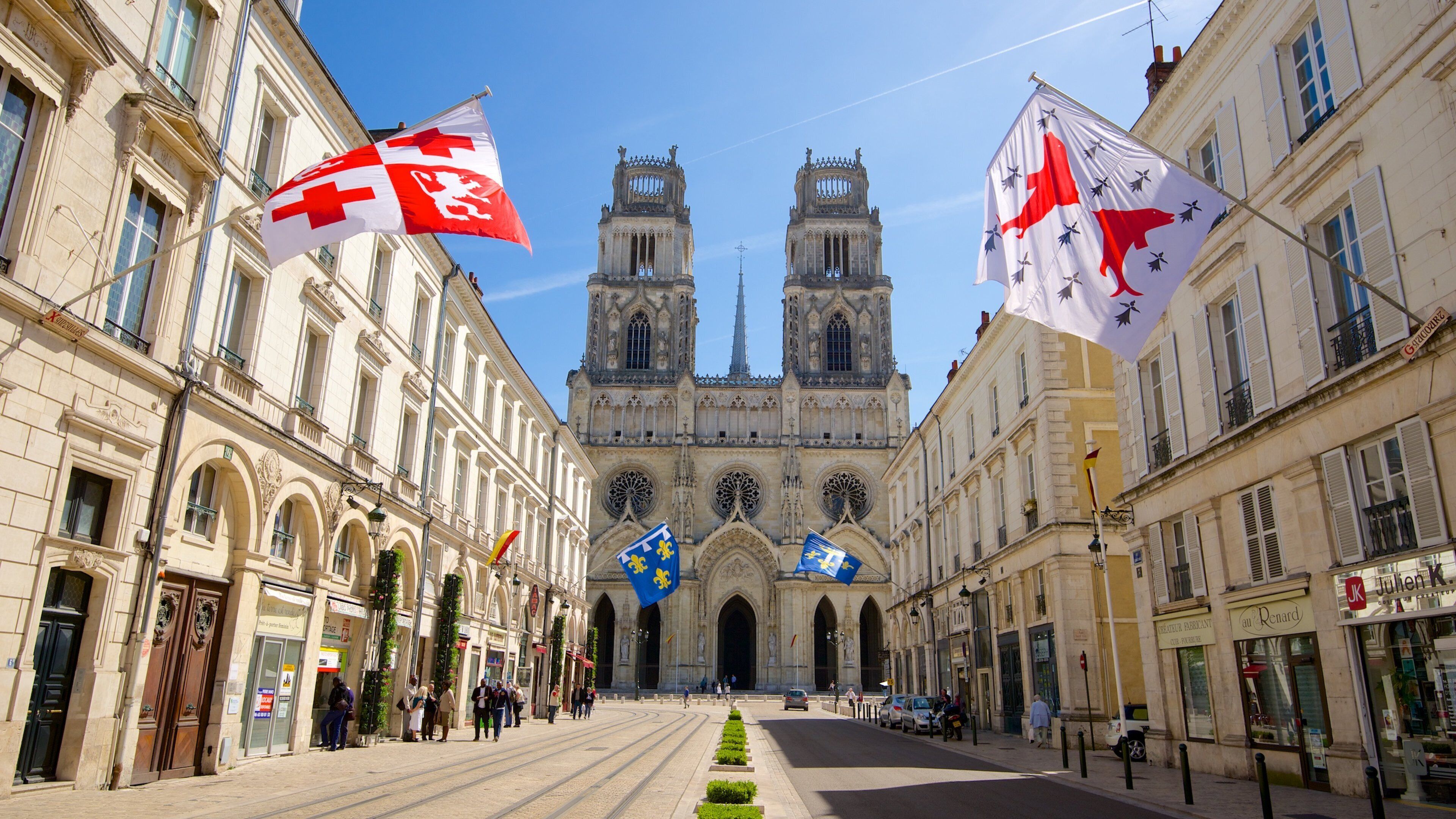 Sainte-Croix Cathedral showing street scenes, heritage architecture and a church or cathedral