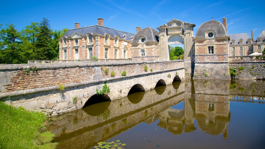 Chateau de la Ferte-St-Aubin which includes a small town or village, a river or creek and a bridge