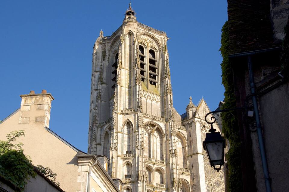 A historic church with intricate architecture and a tall bell tower.