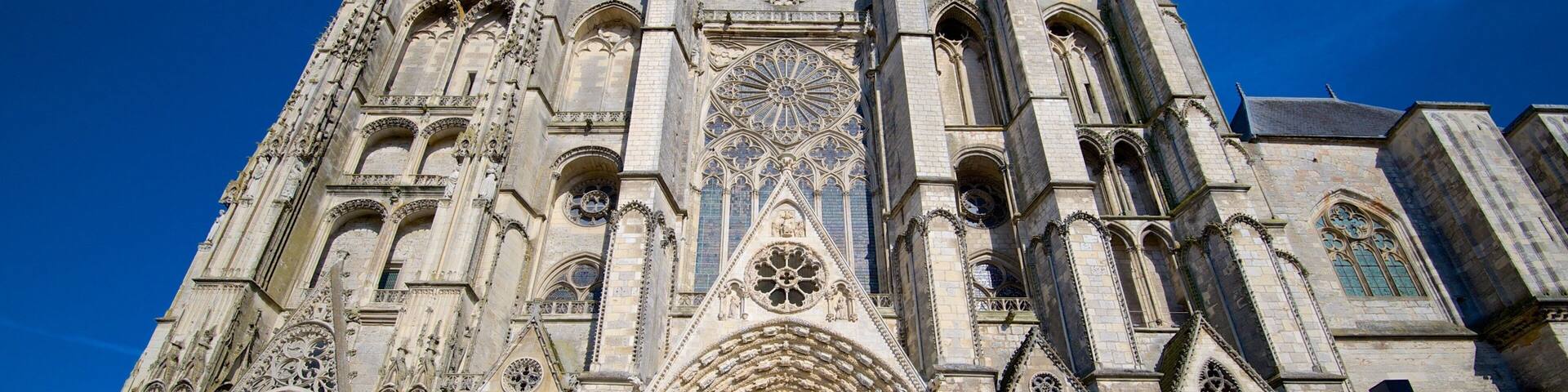 A Gothic cathedral with intricate stone carvings, large rose windows, and pointed arches.
