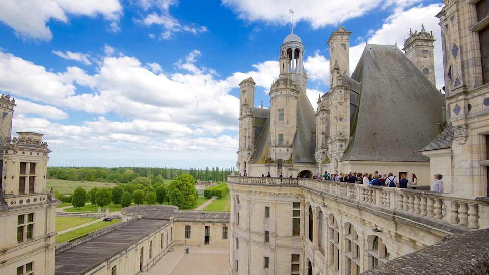 A historic castle with multiple towers and a large courtyard.