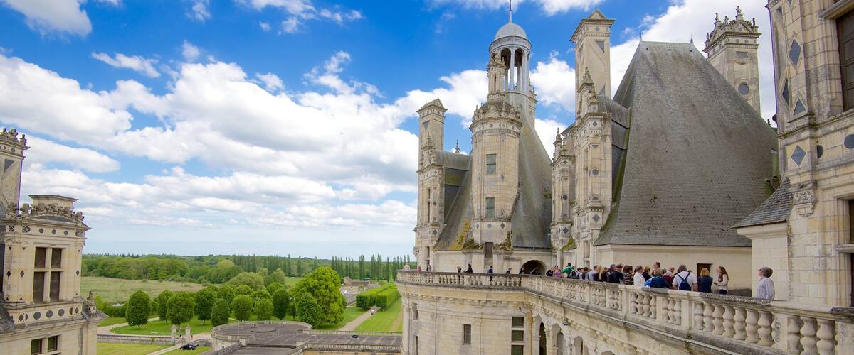 A historic castle with multiple towers and a large courtyard.