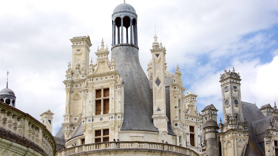 A grand, ornate building with a distinctive tower featuring a spiral design.