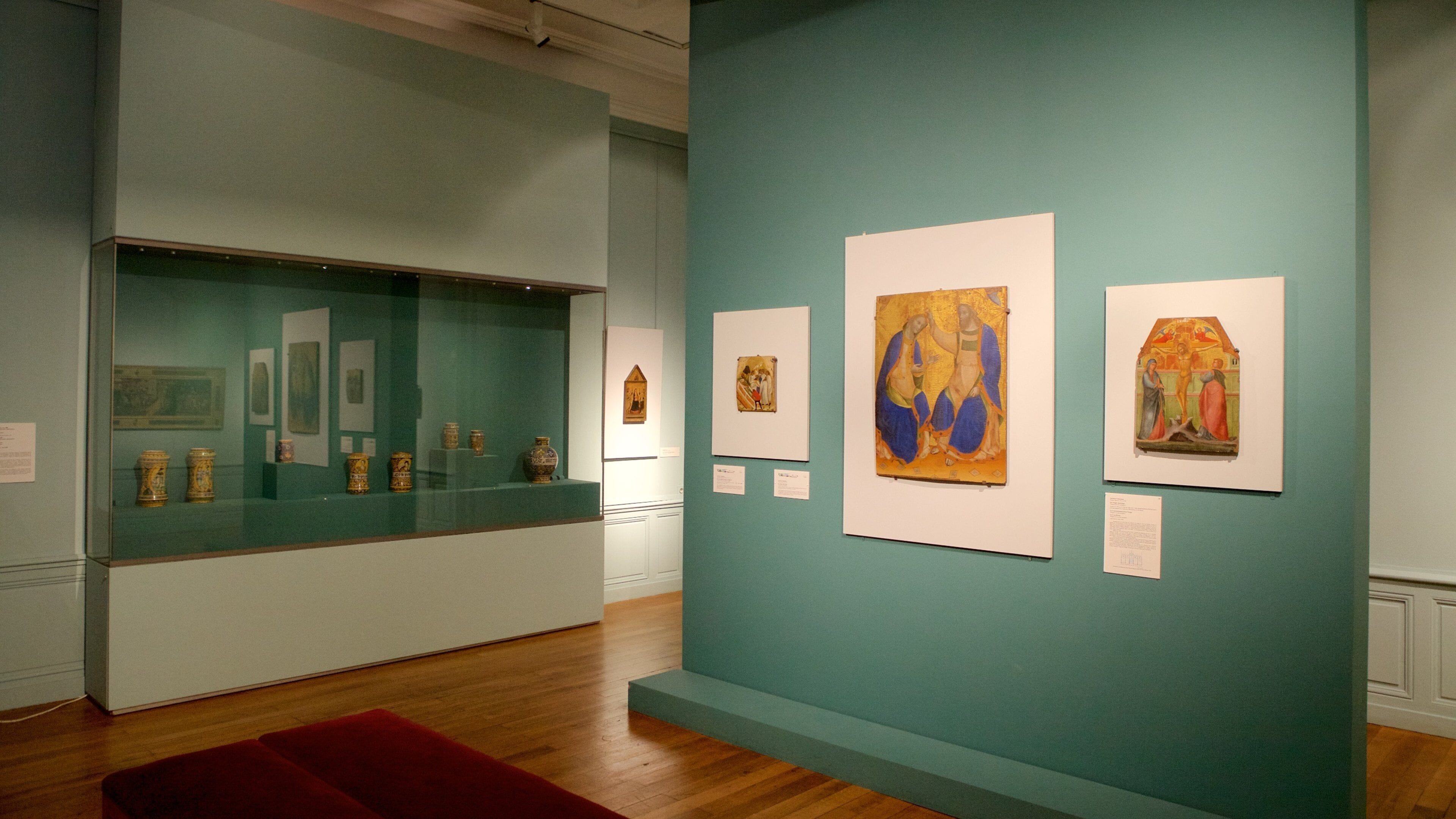 An art gallery with various paintings and sculptures on display.