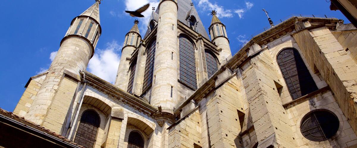 A historic church with multiple spires and arched windows.