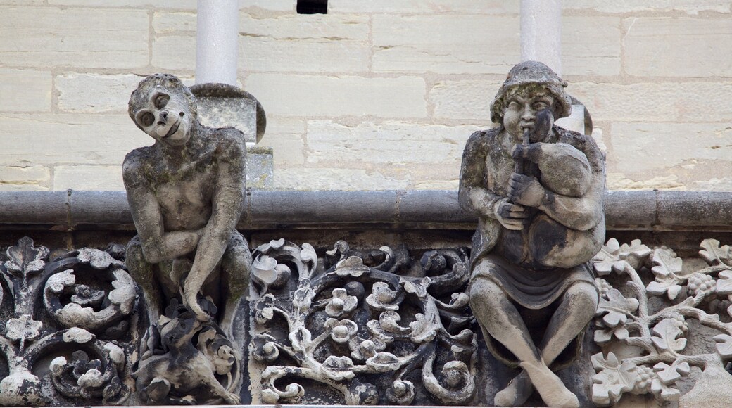 Church of Notre Dame which includes a church or cathedral and a statue or sculpture