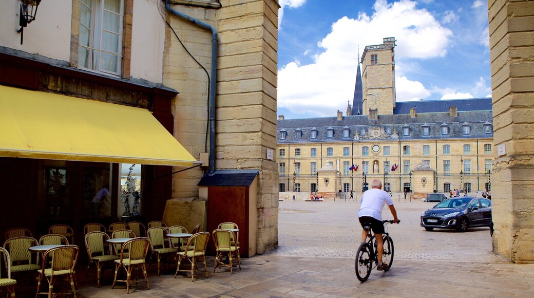 Liberation Square showing cafe scenes as well as an individual male