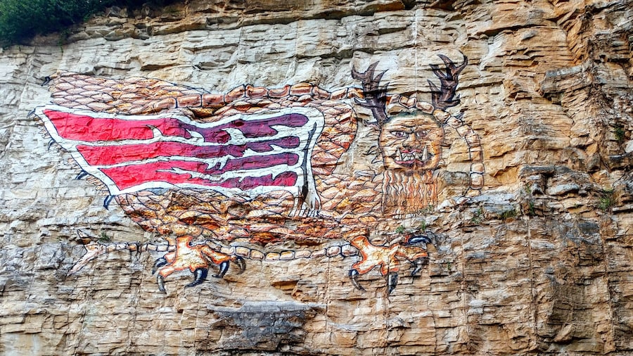A modern depiction of a mythical Native American dragon on a limestone bluff in Alton, Illinois.
