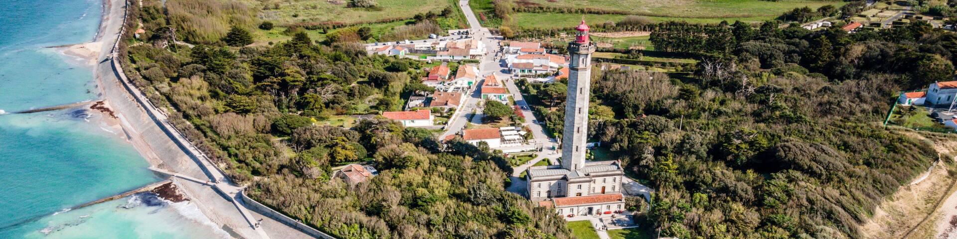 Aerial drone panorama shot of the Phare des Baleines or Lighthouse of the Whales taken from the sea on Ile de Ré or island of Re France