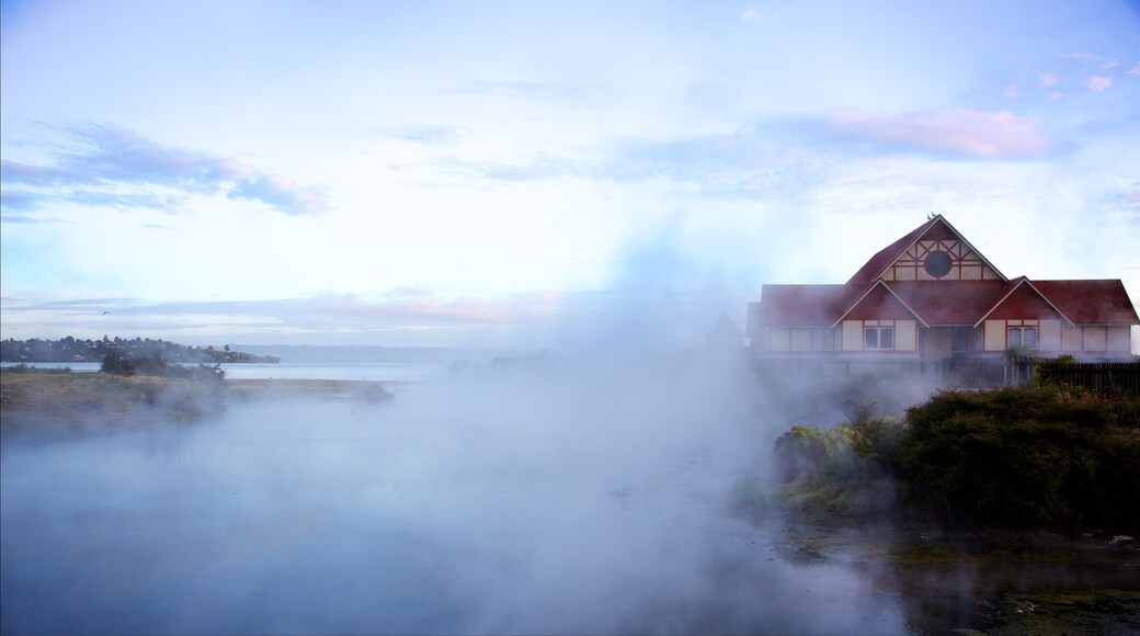 Tama-te-Kapua Meeting House showing a sunset, mist or fog and a hot spring