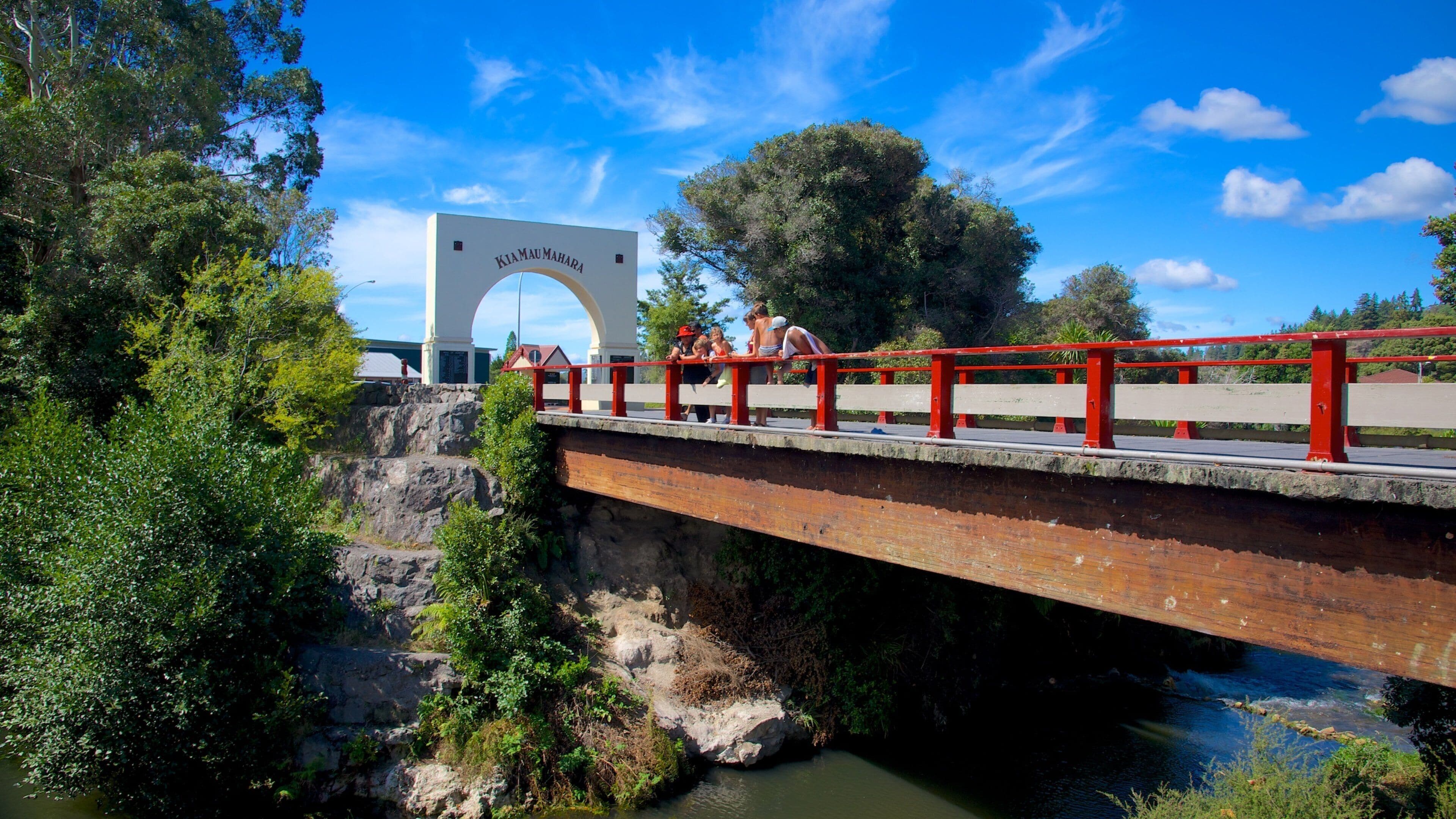 Whakarewarewa Thermal Reserve featuring a bridge and a river or creek