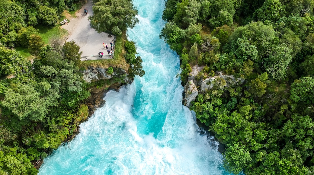 Stunning aerial wide angle drone view of Huka Falls waterfall in Wairakei near Lake Taupo in New Zealand. The waterfall is part of the Waikato River and is a major tourist attraction.