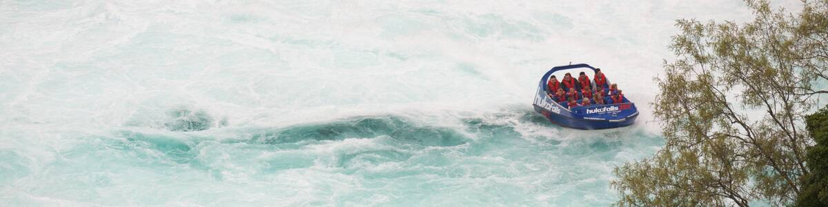Huka Falls featuring rapids, a river or creek and boating