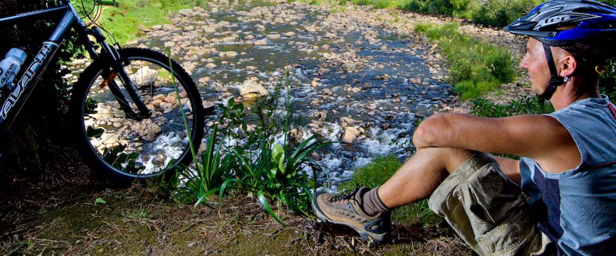 Karangahake Gorge which includes a river or creek and mountain biking as well as an individual male
