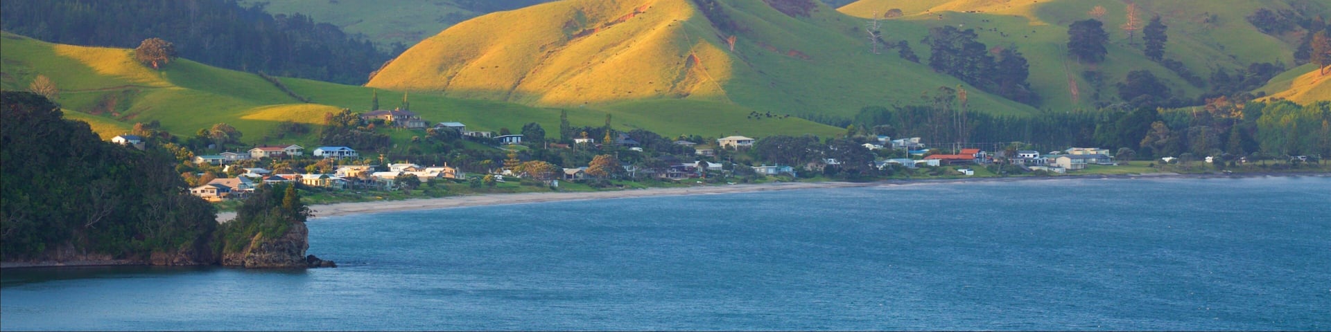 Shakespeare Cliff Lookout which includes a sunset, a coastal town and a bay or harbor