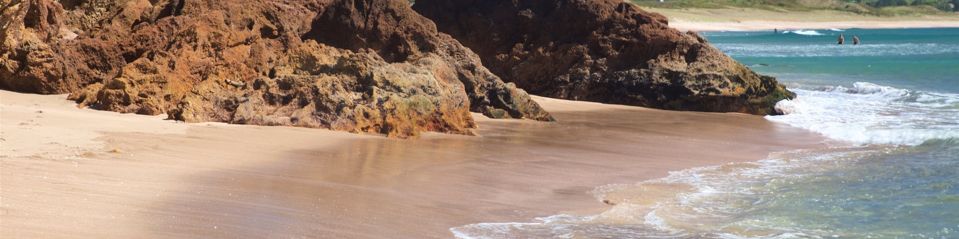 Hot Water Beach which includes rocky coastline, a sandy beach and general coastal views