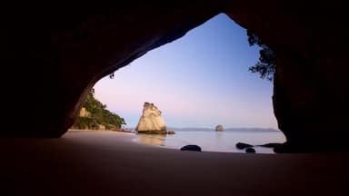 Cathedral Cove Beach which includes a sunset, a beach and general coastal views