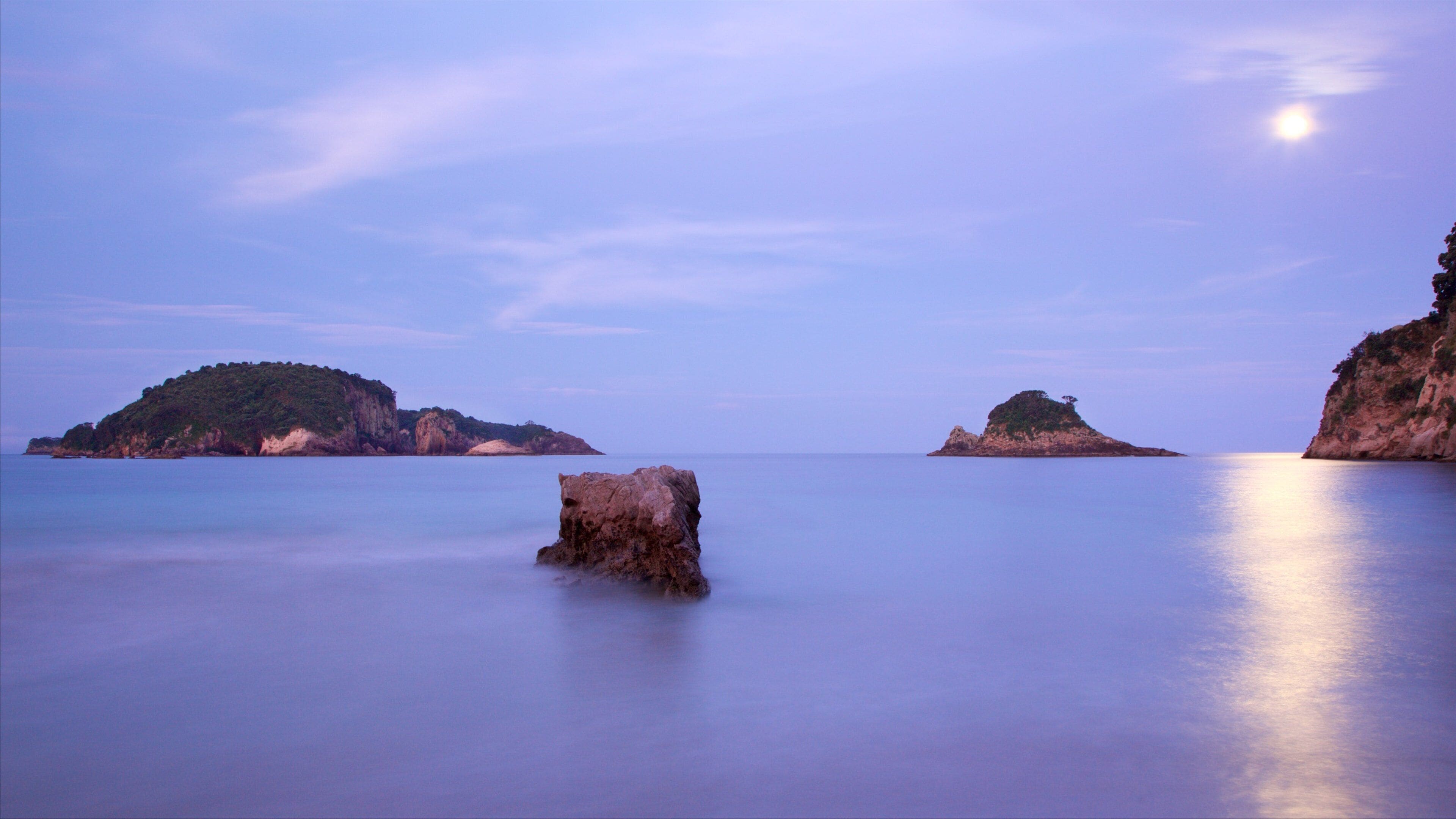 Hahei Beach showing a bay or harbor, a sunset and island images