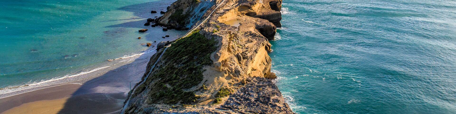 Castlepoint Lighthouse drone perspective on a summers day in New Zealand