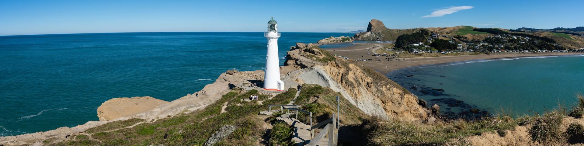 Castlepoint Lighthouse in the Wairarapa, New Zealand on a clear sunny day