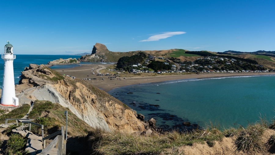 Castlepoint Lighthouse in the Wairarapa, New Zealand on a clear sunny day