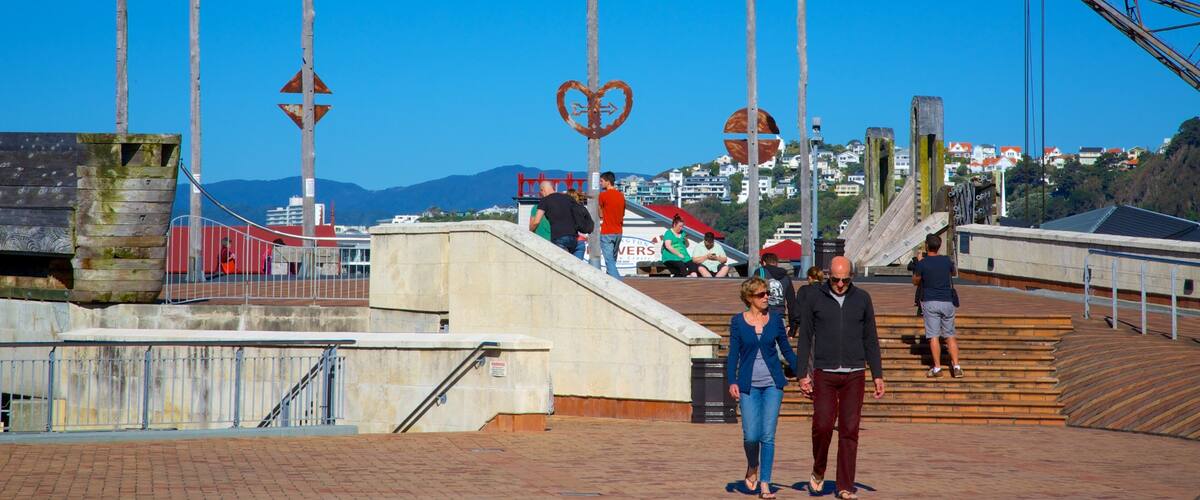 Civic Square showing outdoor art and a square or plaza as well as a couple