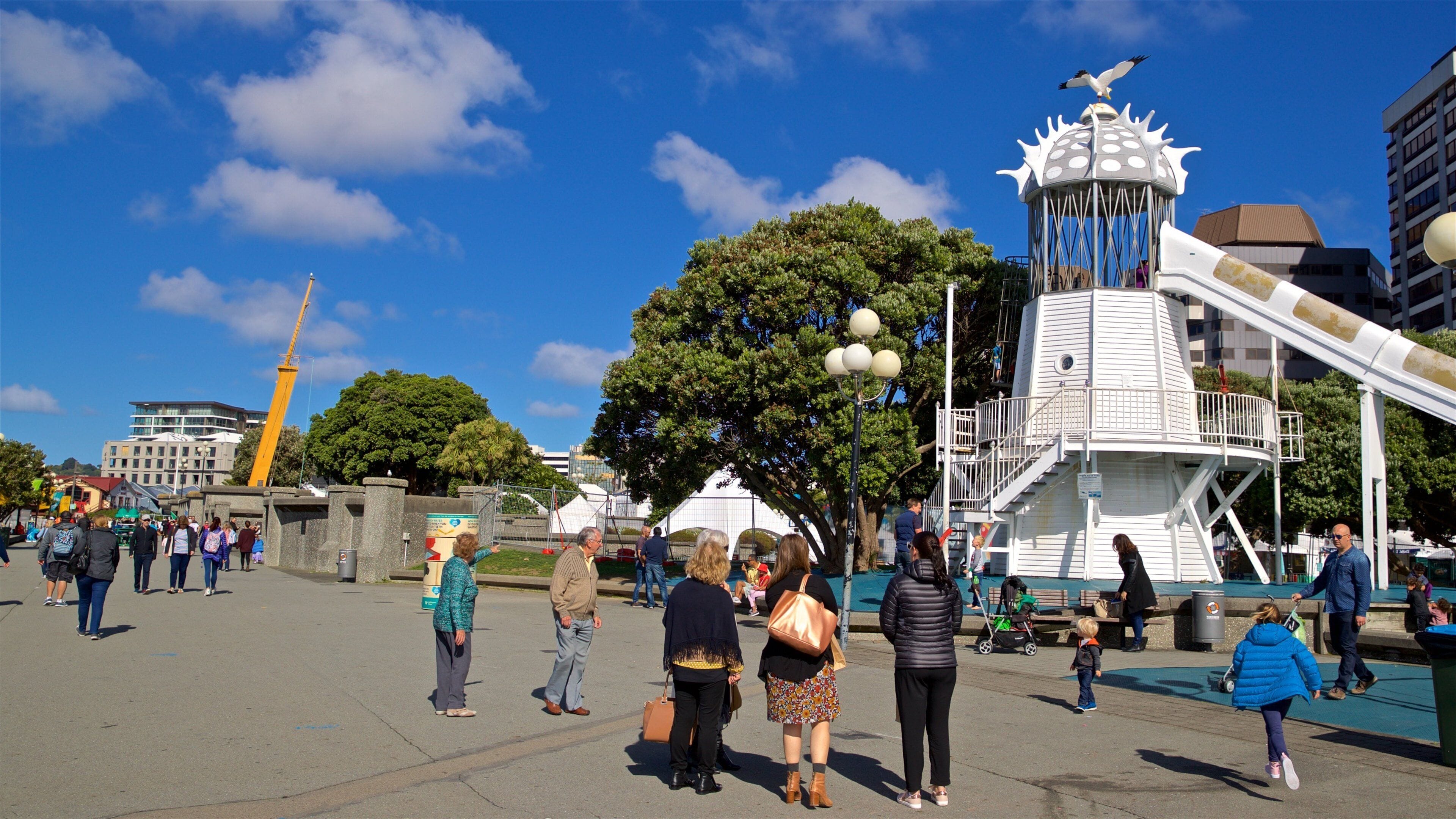 Frank Kitts Park featuring street scenes as well as a small group of people