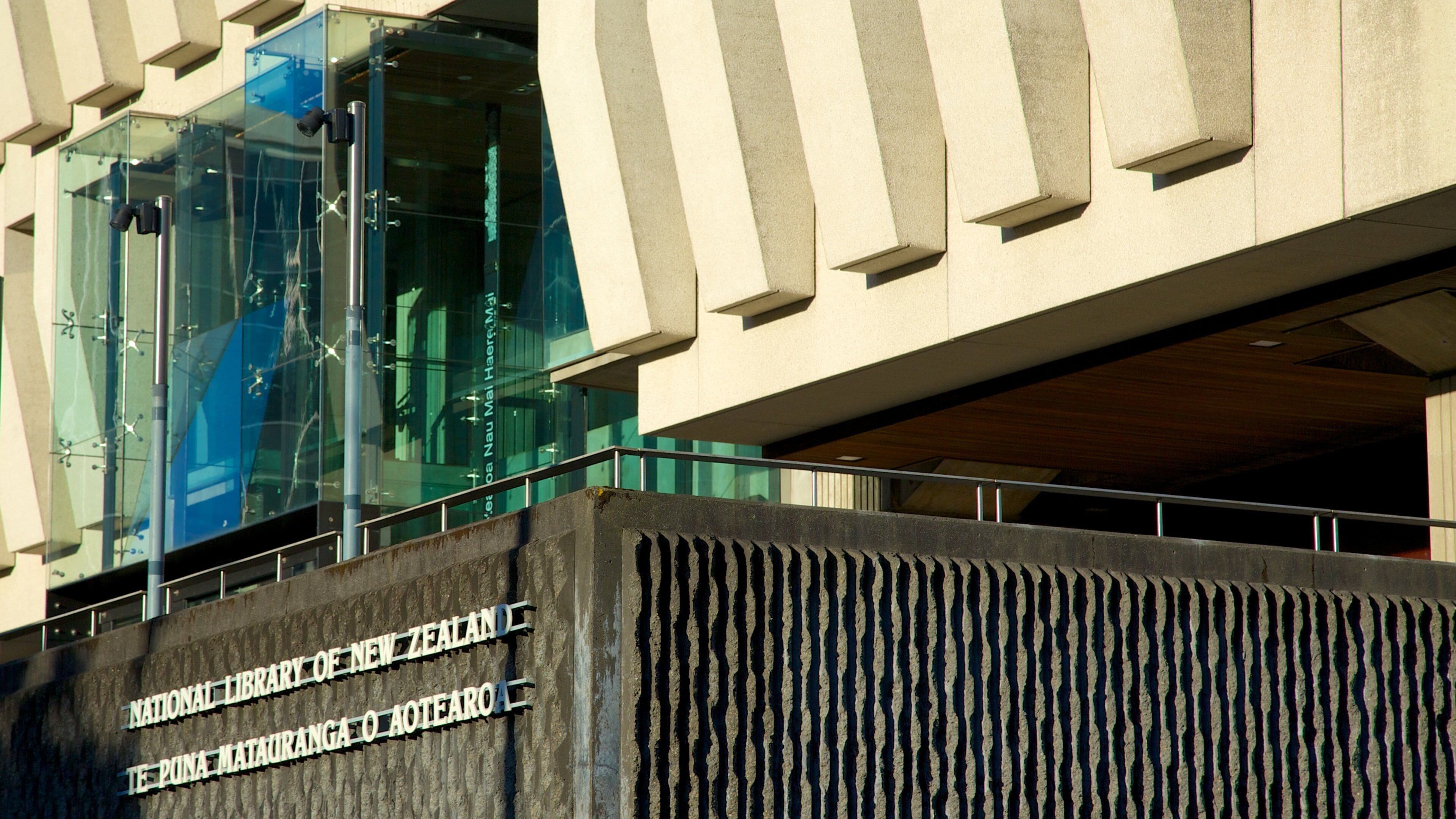 The exterior of the National Library of New Zealand building with a prominent sign.