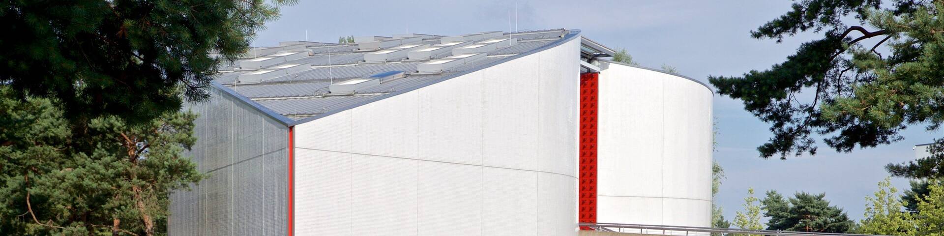 Volkswagen Autostadt Complex showing modern architecture, a bridge and a lake or waterhole