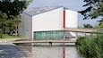 Volkswagen Autostadt Complex showing modern architecture, a bridge and a lake or waterhole