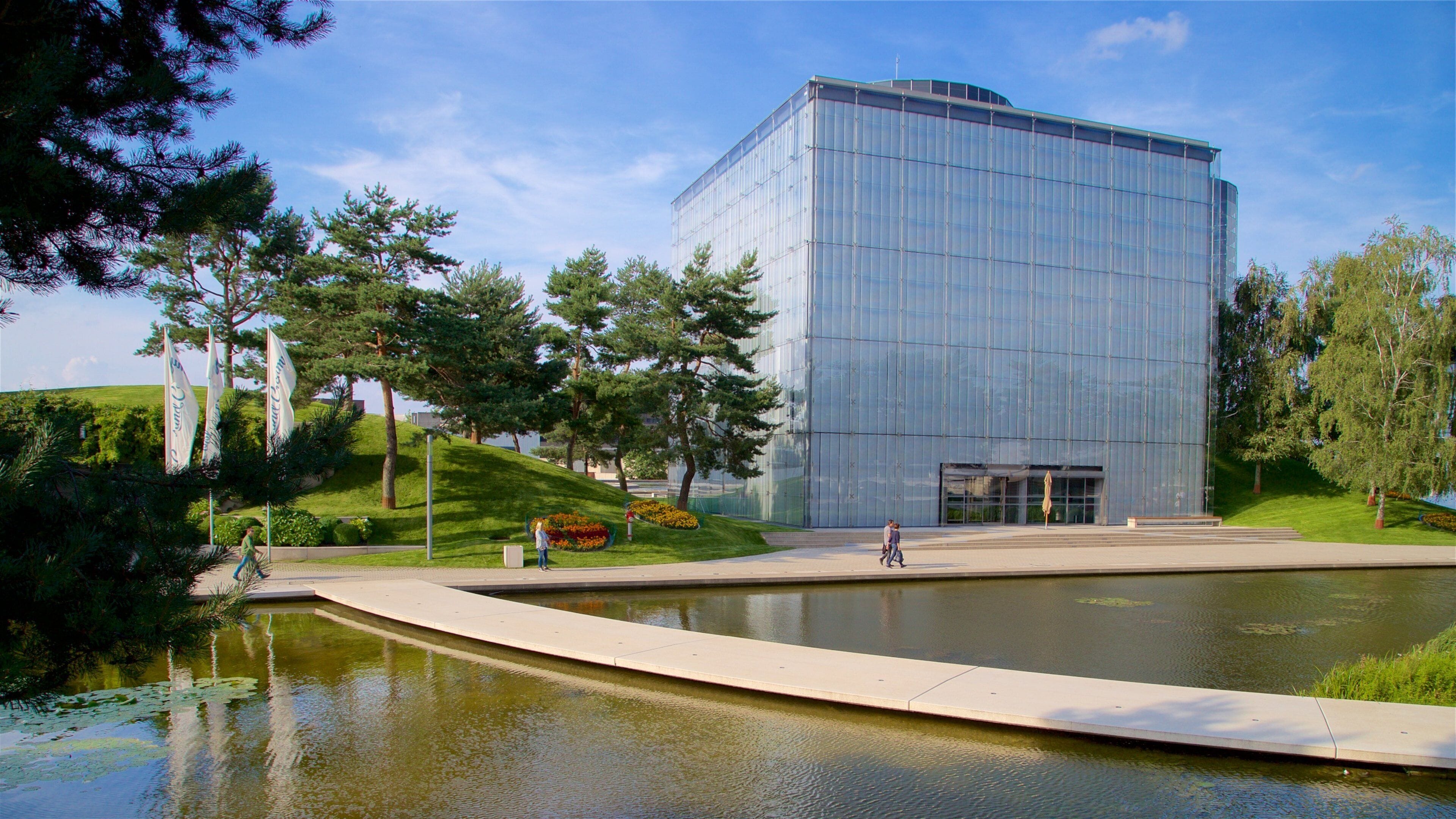 Volkswagen Autostadt Complex featuring a park, a lake or waterhole and modern architecture