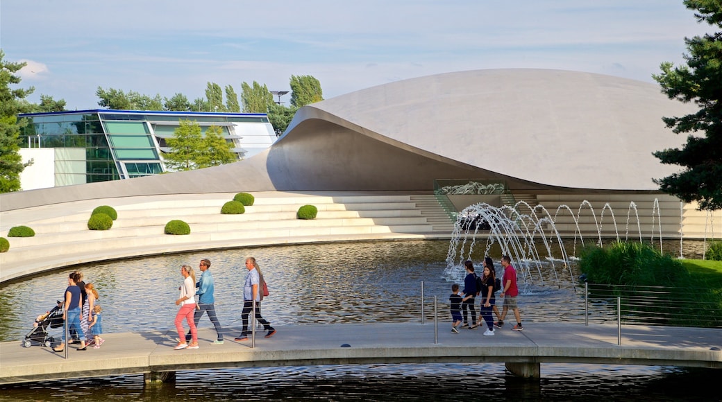 Volkswagen Autostadt Complex featuring modern architecture, a lake or waterhole and a fountain