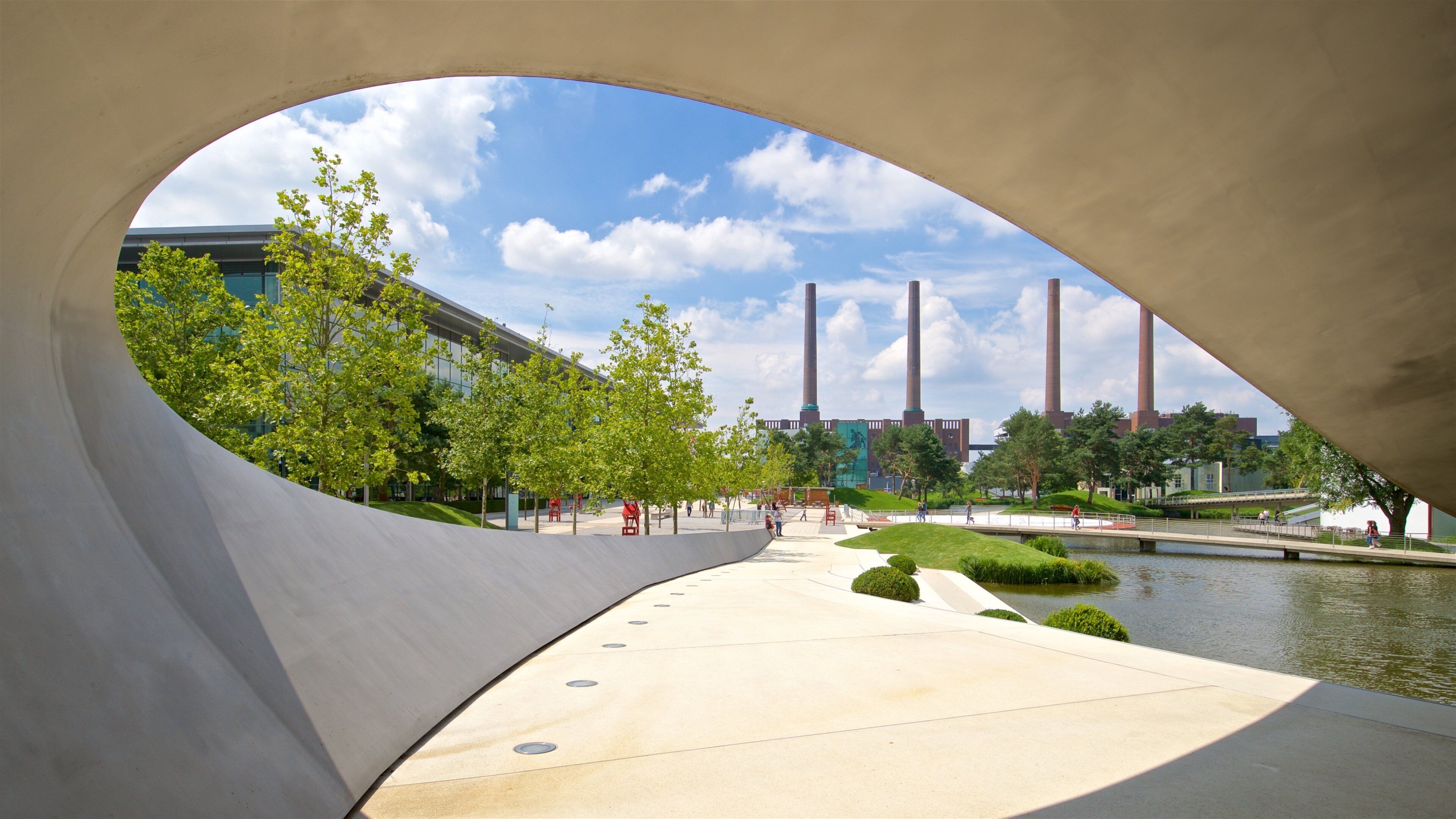 Volkswagen Autostadt Complex which includes a lake or waterhole and modern architecture