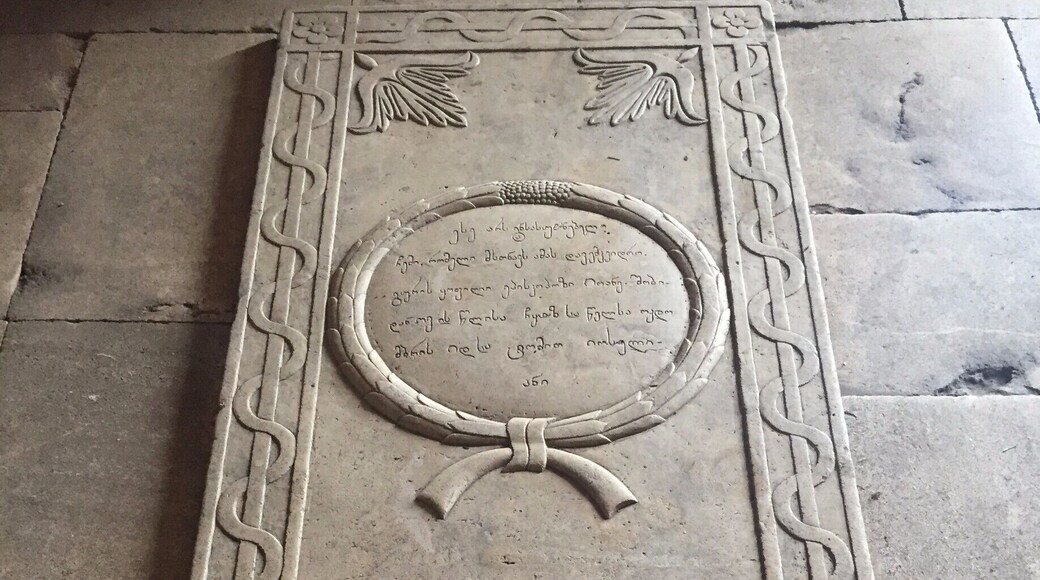 This UNESCO designated monastery in The Republic of Georgia was super busy despite the season and despite the rainy weather. There were people praying and monks chanting. The whole scene was magic.
And then our hearts broke just a little bit at seeing this single wilting rose placed on the grave of some king or saint or holy person.