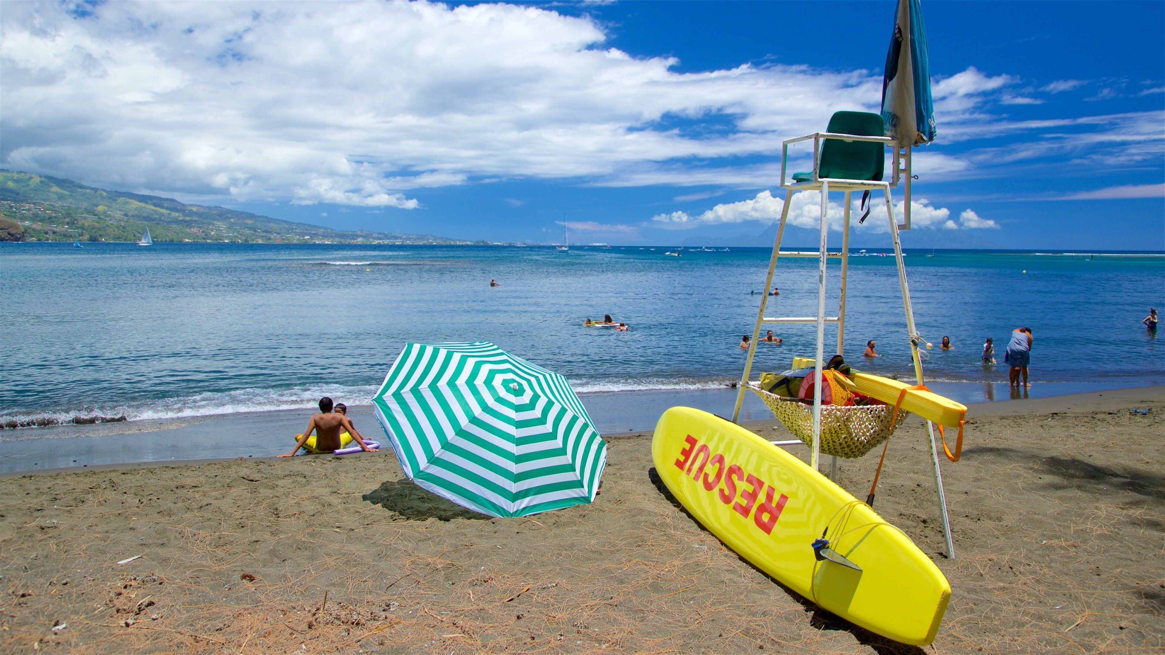 Black Sand Beach showing general coastal views, swimming and a sandy beach