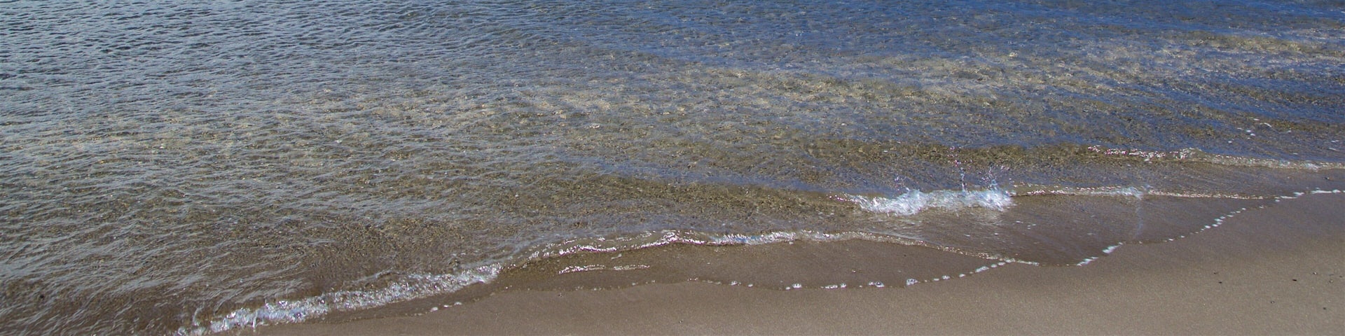 Black Sand Beach which includes swimming and general coastal views