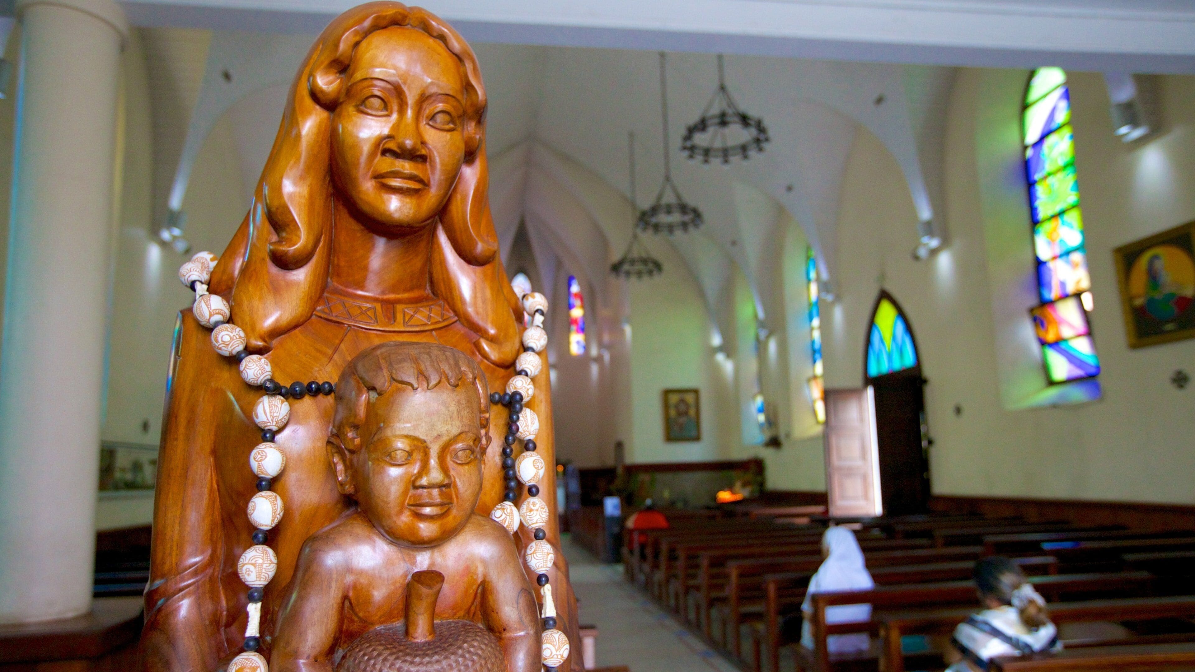 Cathedrale de L\'lmmaculee Conception featuring a statue or sculpture, a church or cathedral and interior views