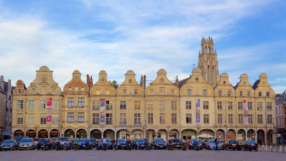 A historic building with ornate architecture and a prominent tower.