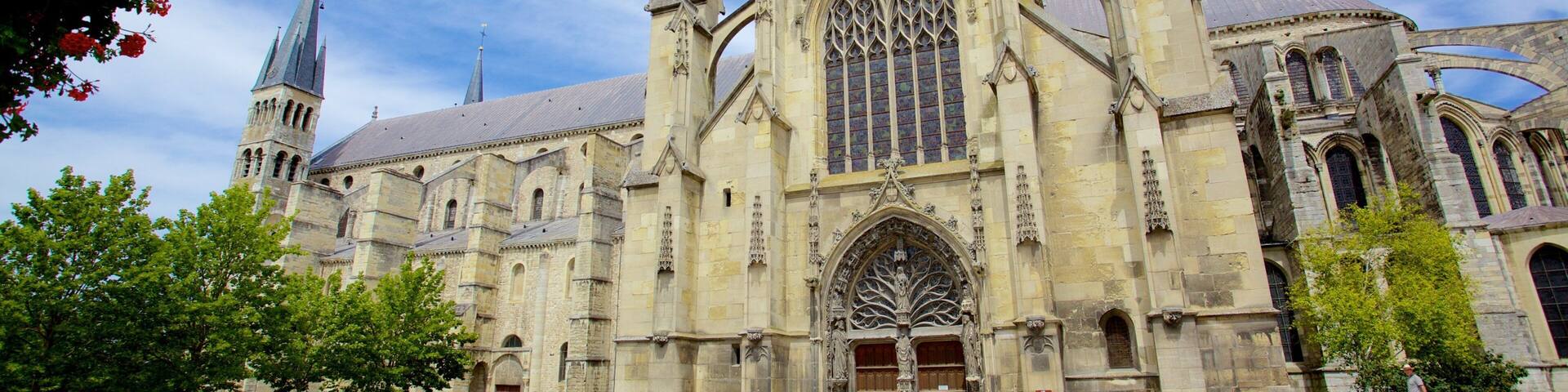 A historic cathedral with a large rose window and a tall spire.
