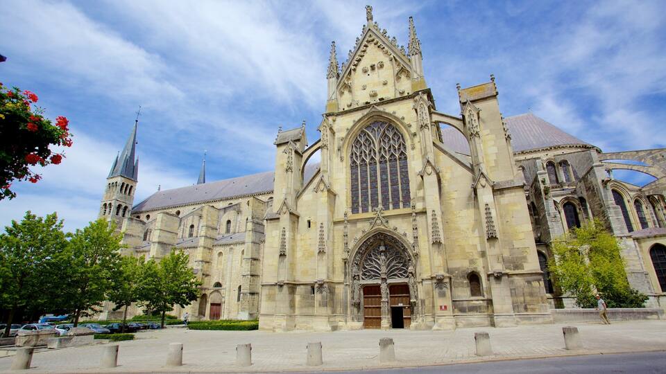A historic cathedral with a large rose window and a tall spire.