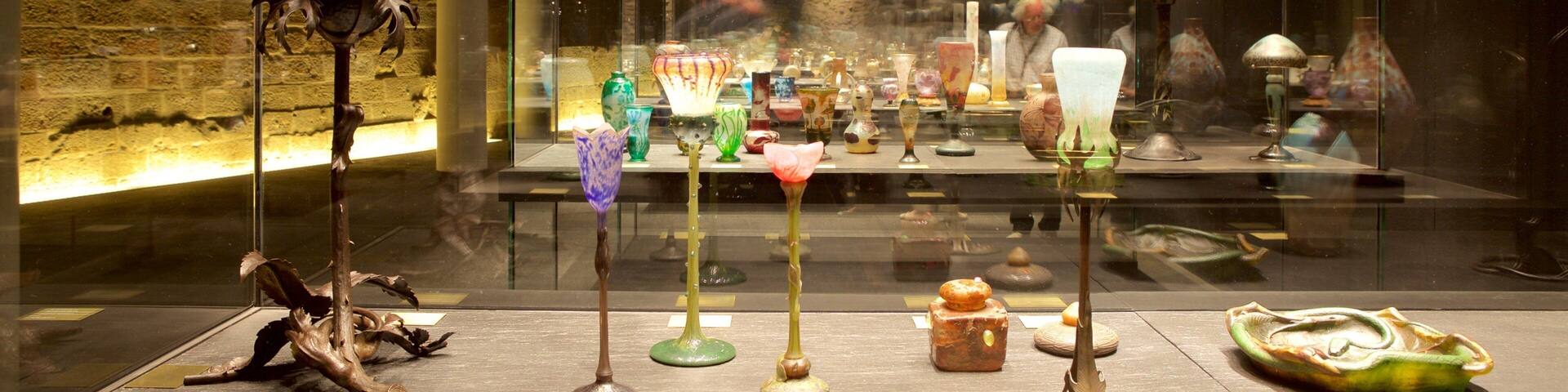A glass art exhibition with various colorful glass sculptures and lamps.