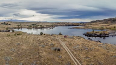 Dry farmland and Butchers Creek reservoir, Alexandra, Otago, New Zealand.