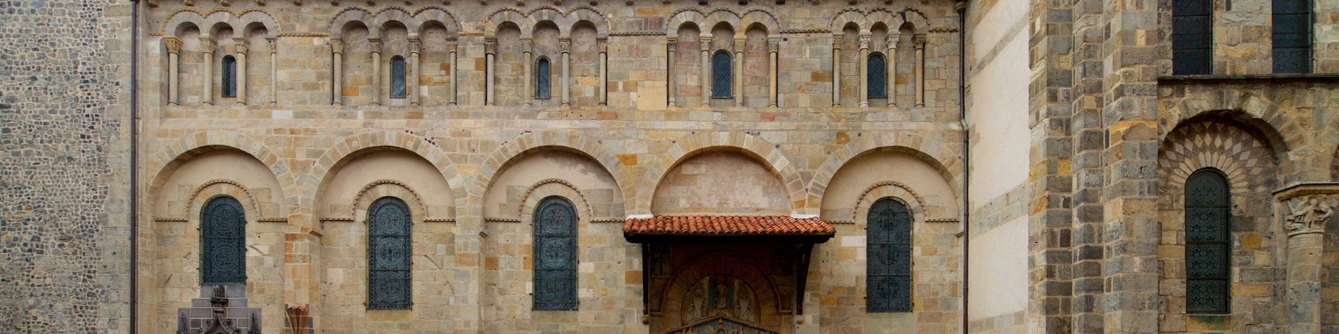 Basilica of Notre-Dame-du-Port featuring heritage architecture as well as an individual male