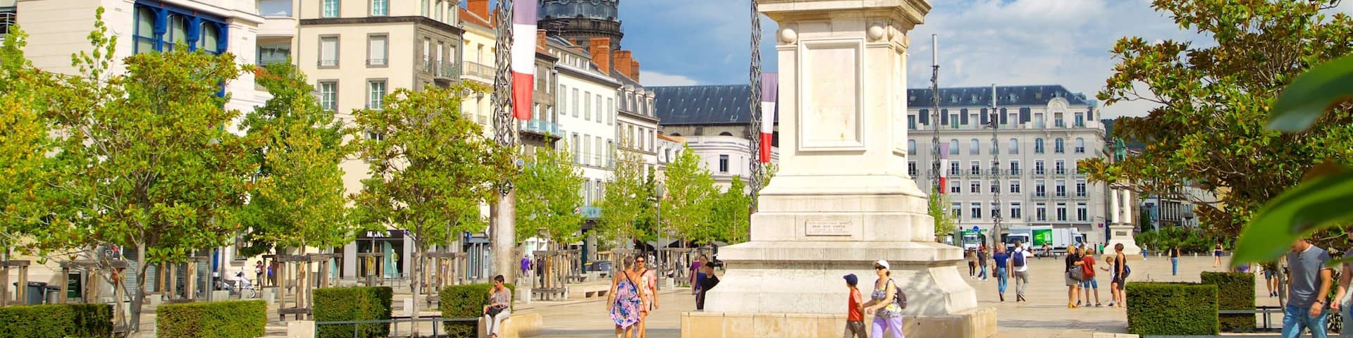 Place de Jaude which includes a monument, a statue or sculpture and a square or plaza