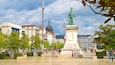 Place de Jaude which includes a monument, a statue or sculpture and a square or plaza