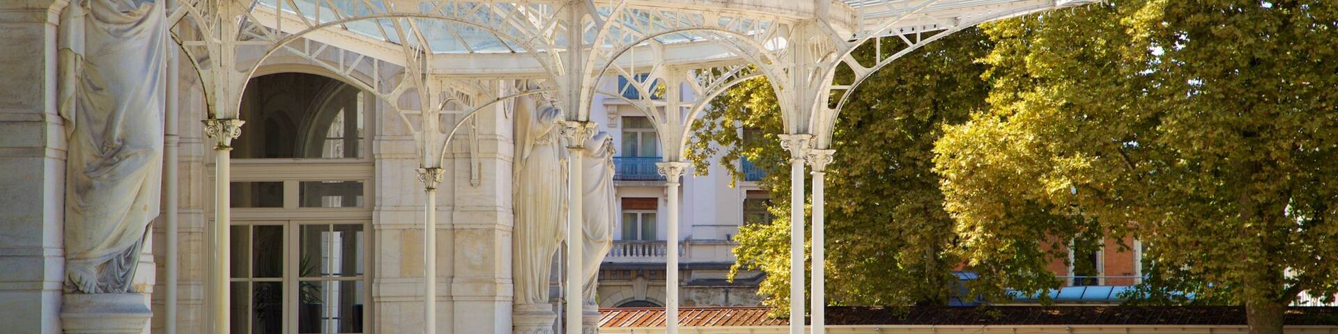 A classical building with a glass roof and columns.